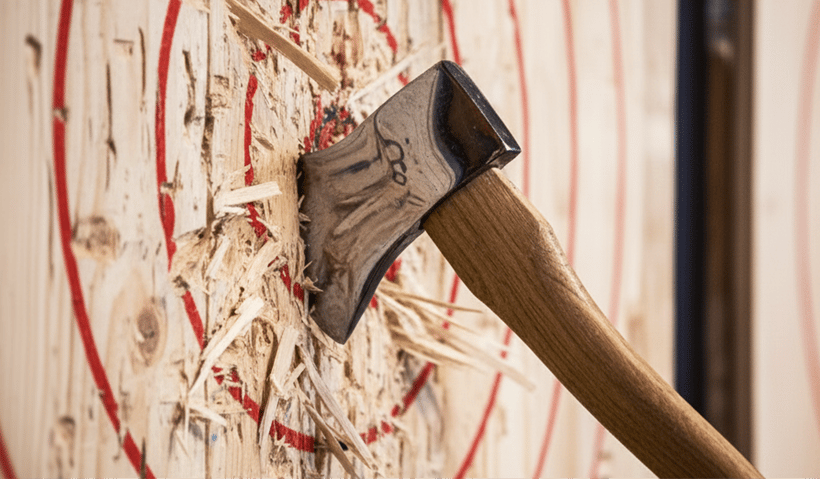 An axe sticking out of a throwing target