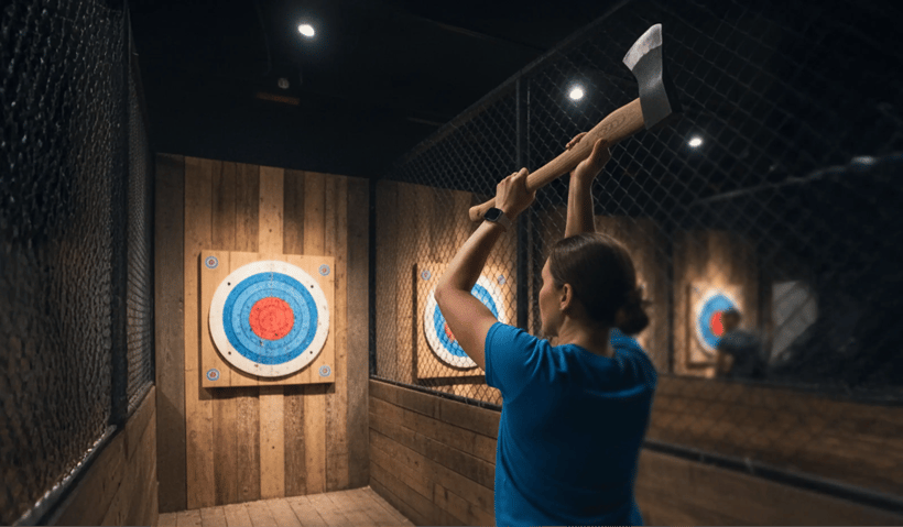A woman throwing axe