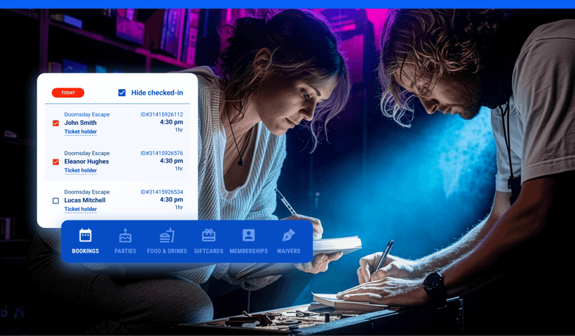 Two people working through a puzzle in an escape room