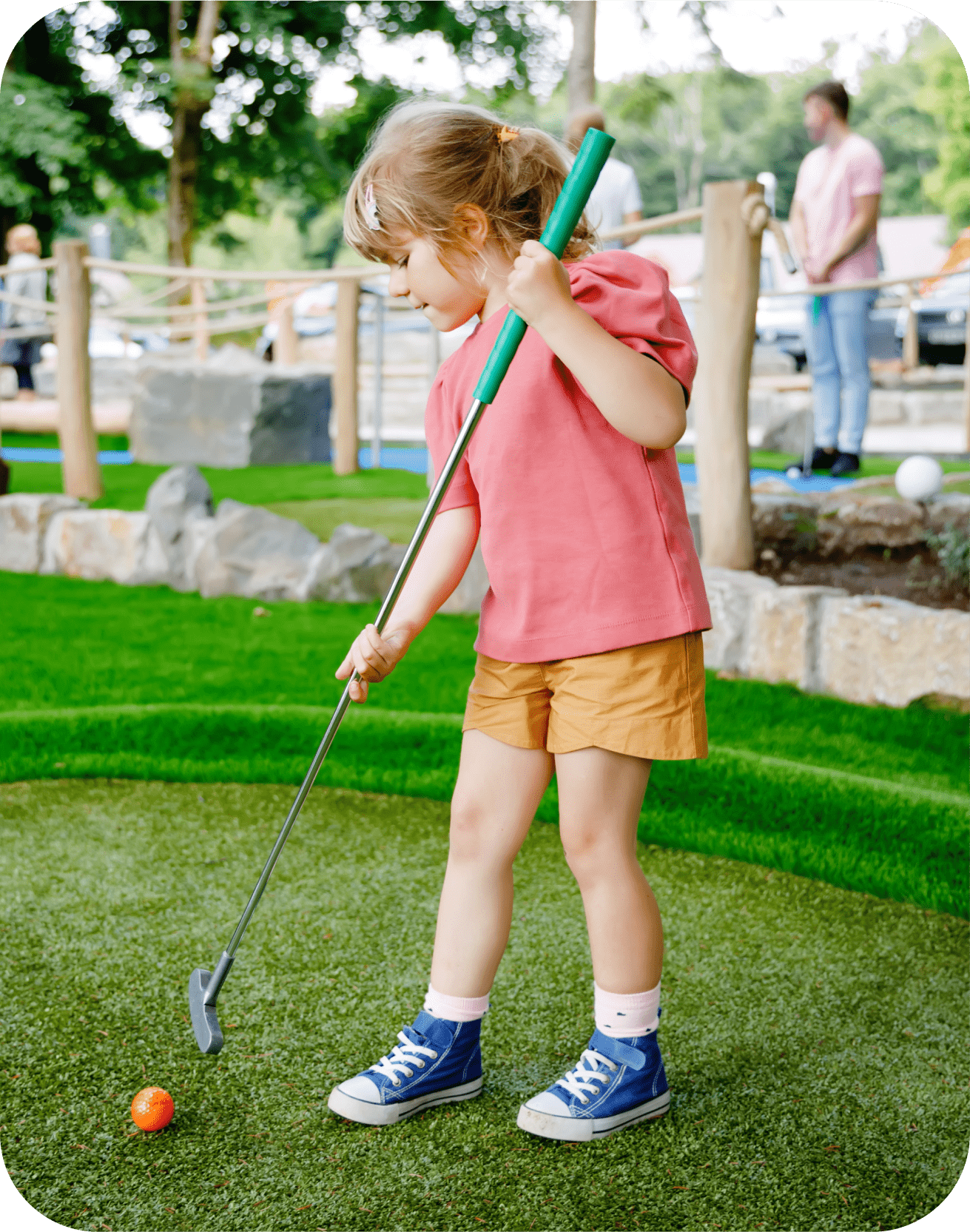 girl playing mini golf