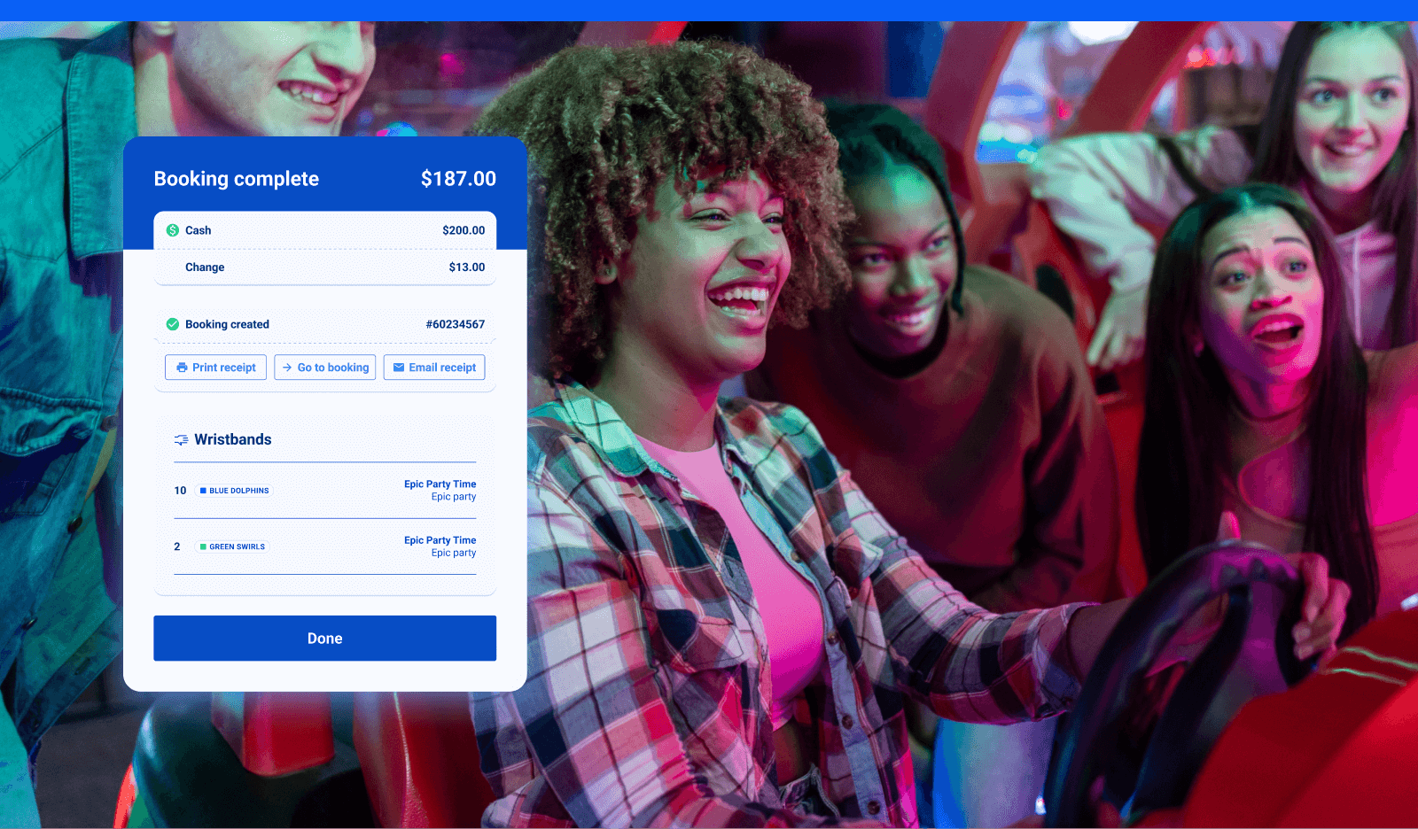 A group of young people playing an arcade game at an FEC