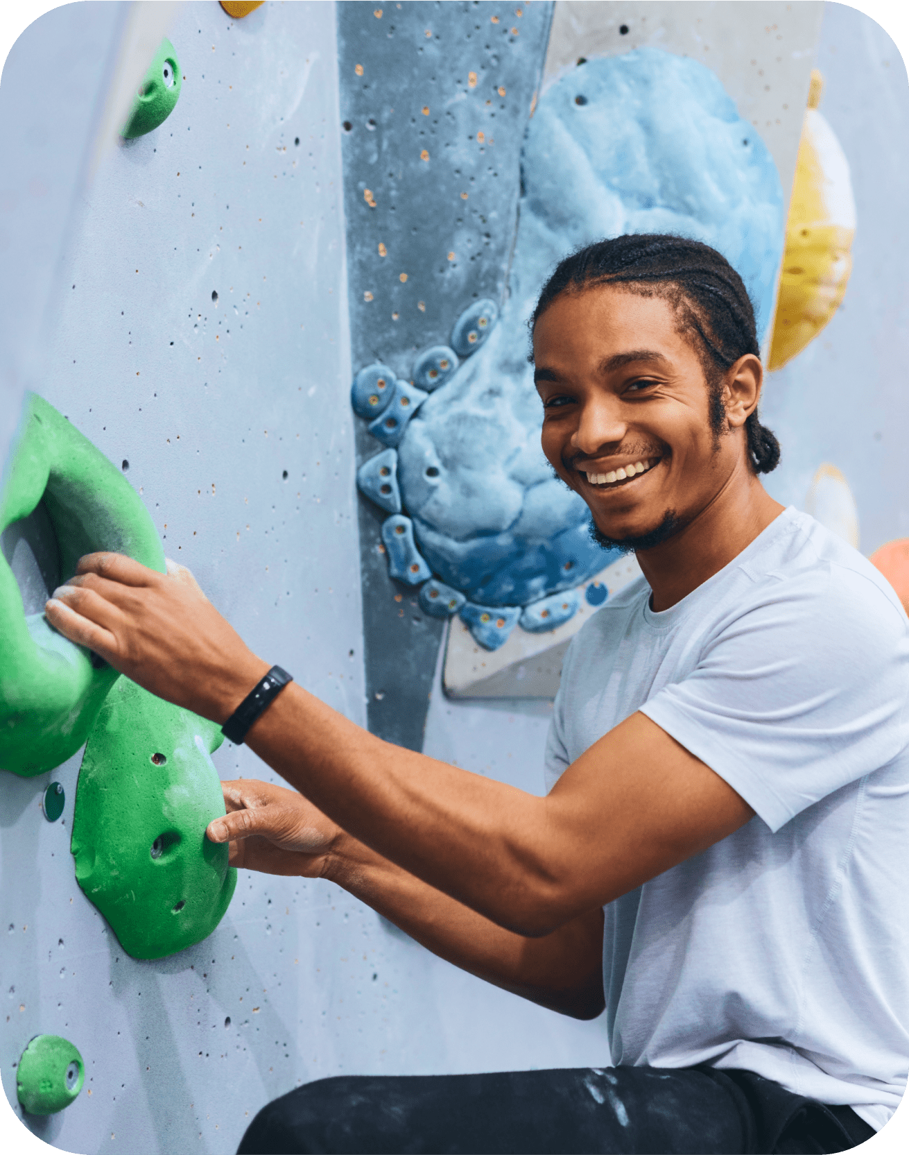 Man climbing up a climbing wall