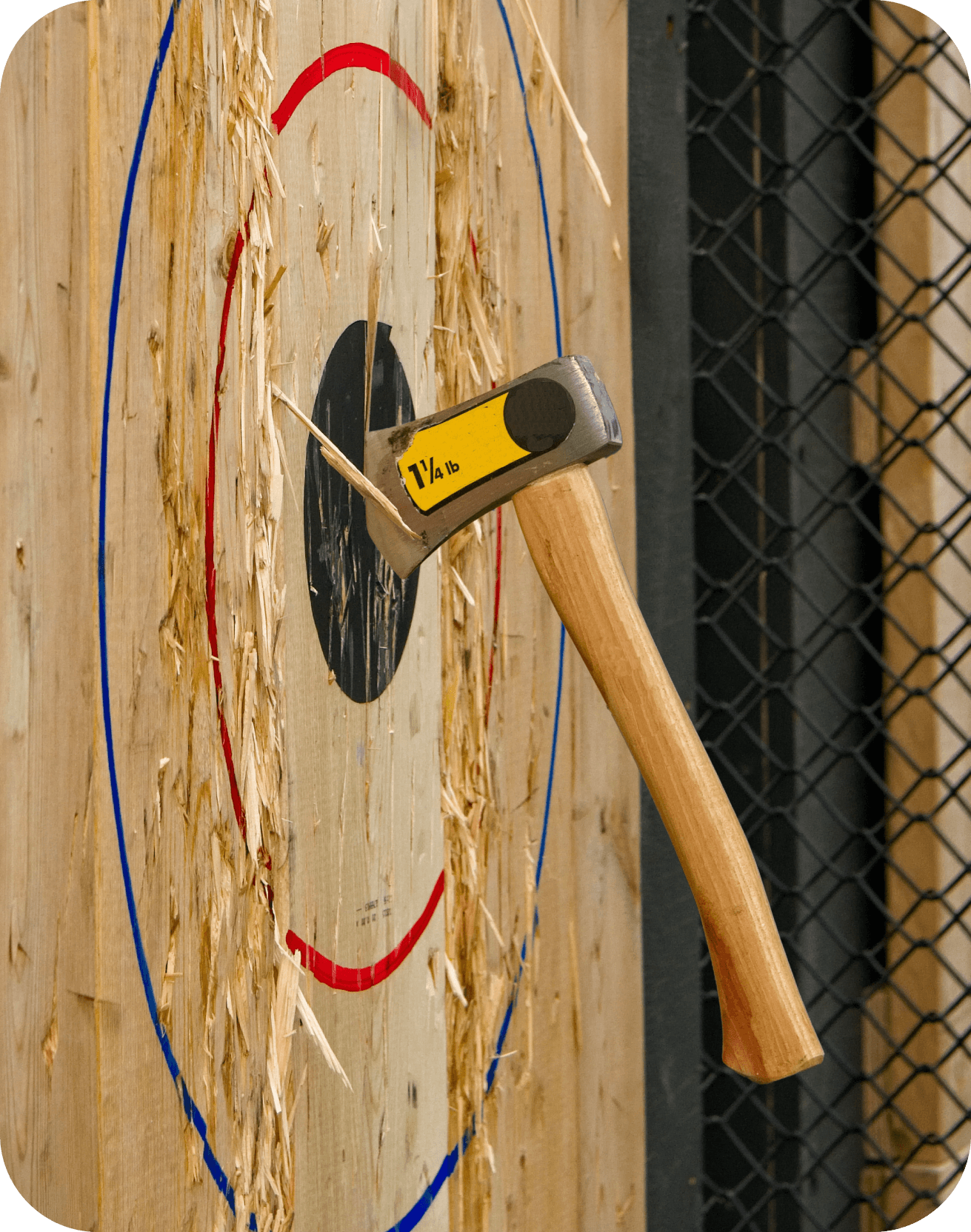 Axe hitting a wooden target at an entertainment venue using ROLLER axe throwing software