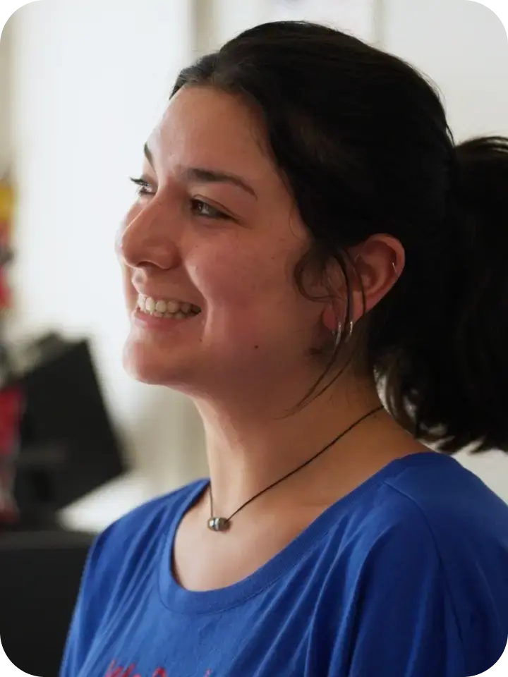 Team member smiling on the gym floor